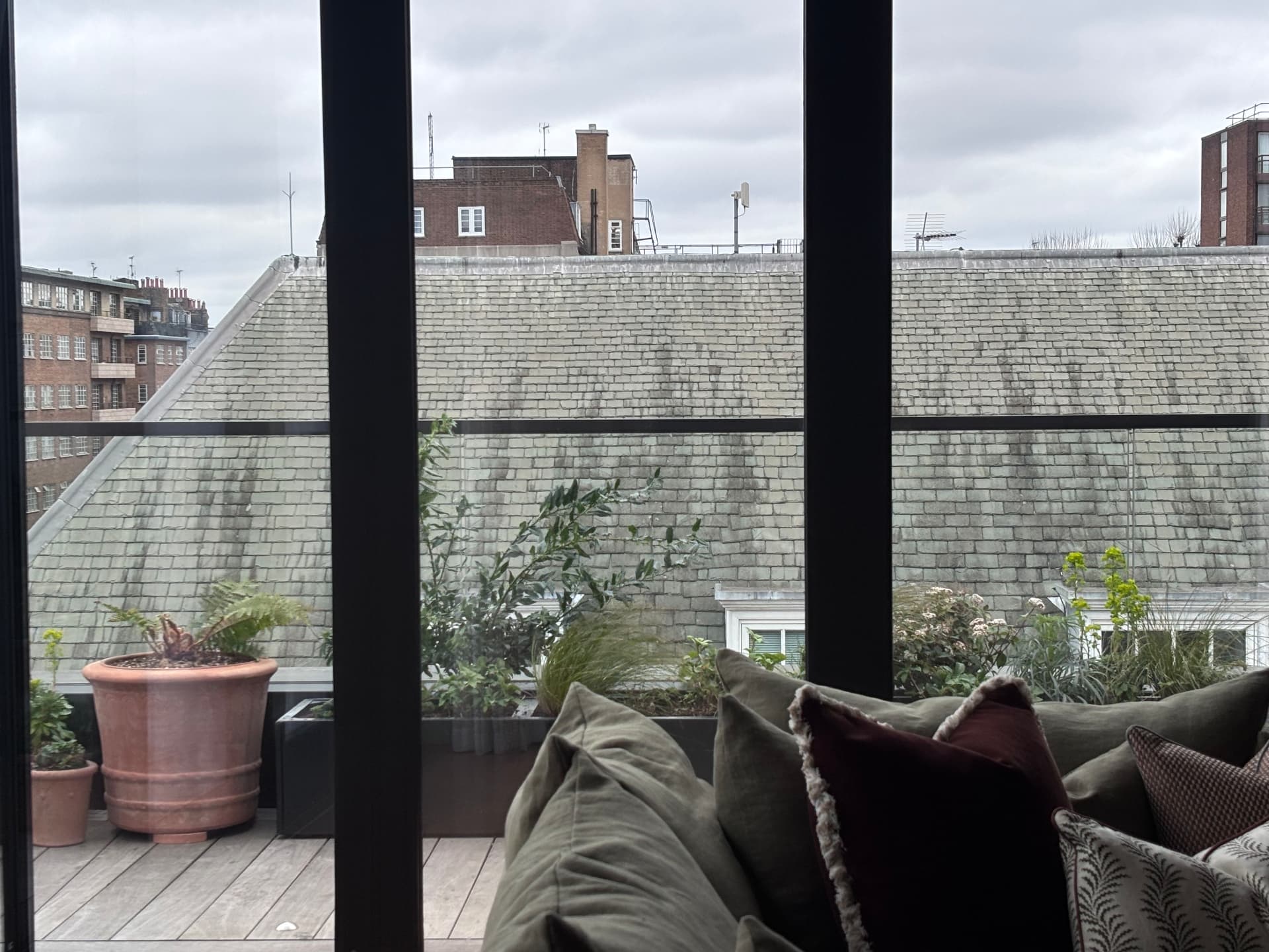 View from the living room across the planted terrace to London rooftops