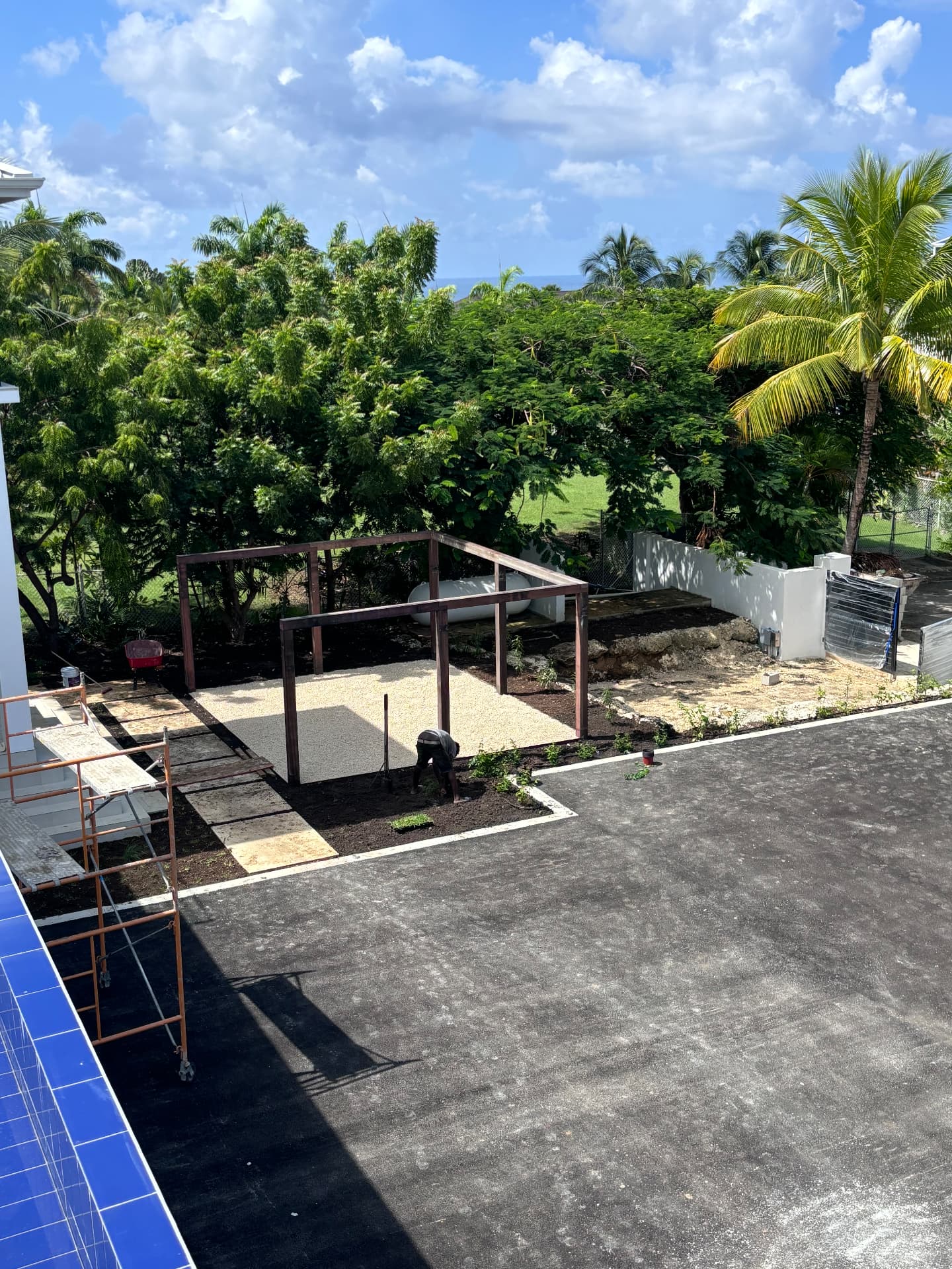 Aerial view of the pergola and gravel court set against mature trees