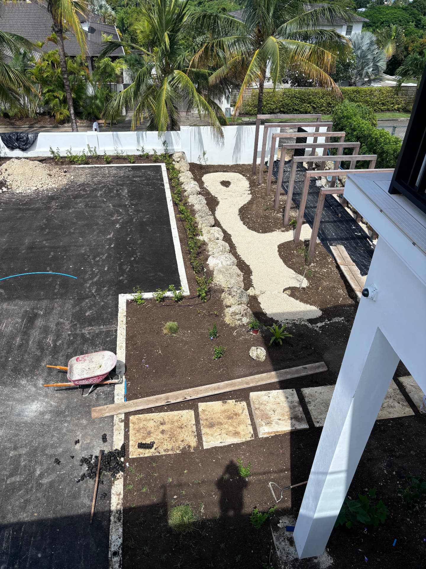 Aerial view of the coral boulder edge, gravel path and new planting beds
