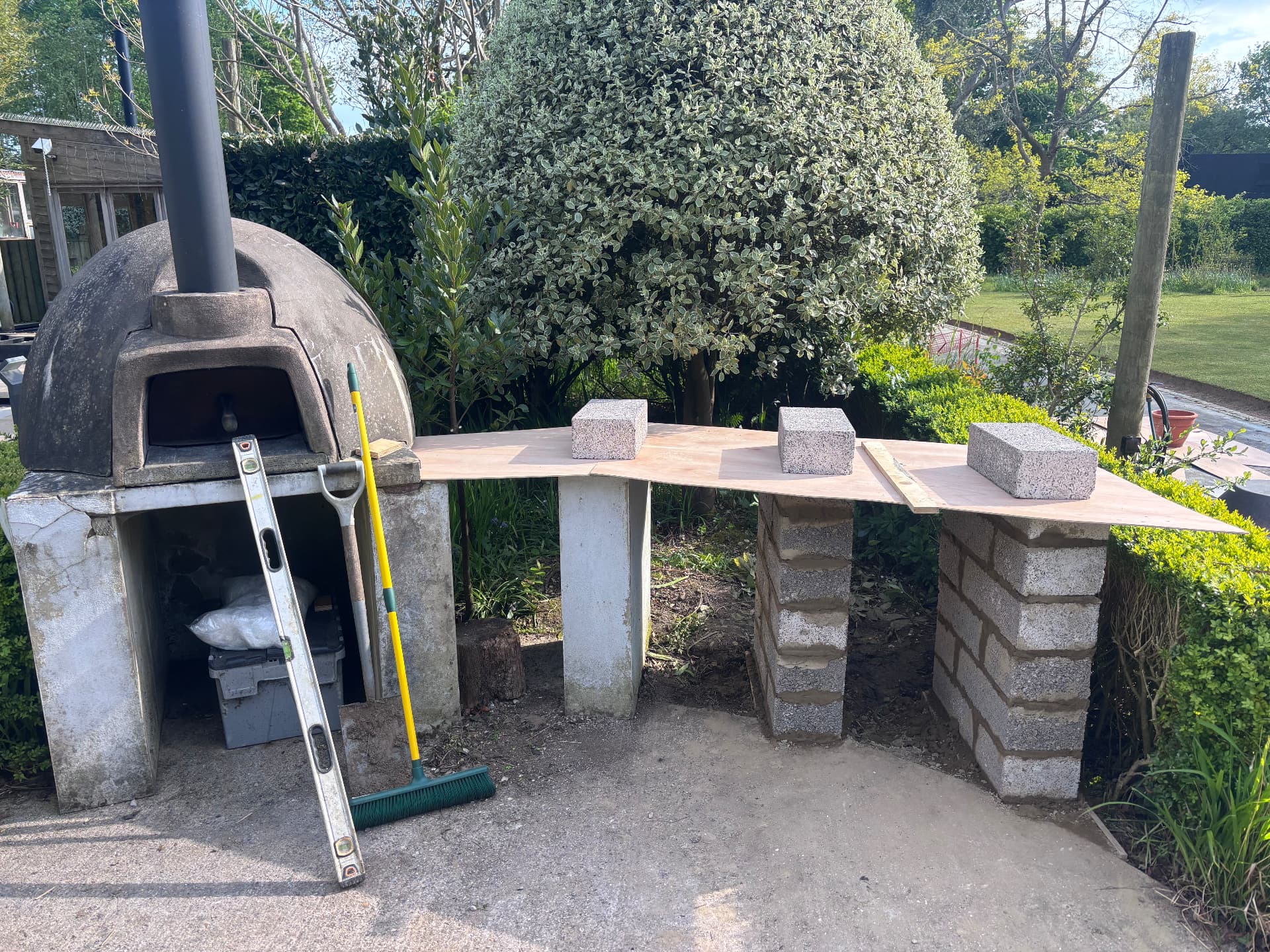 Blockwork piers and template setting out the curved worktop